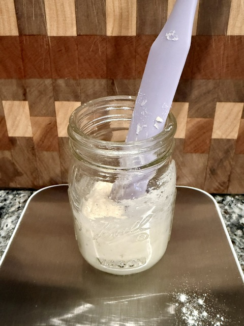 Purple spatula in a small sourdough starter — why the 5 gram sourdough starter method works