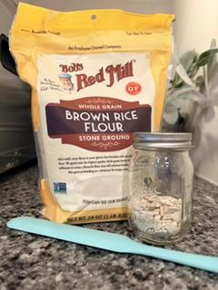 Ingredients for gluten-free starter: dehydrated flakes, warm water, and brown rice flour